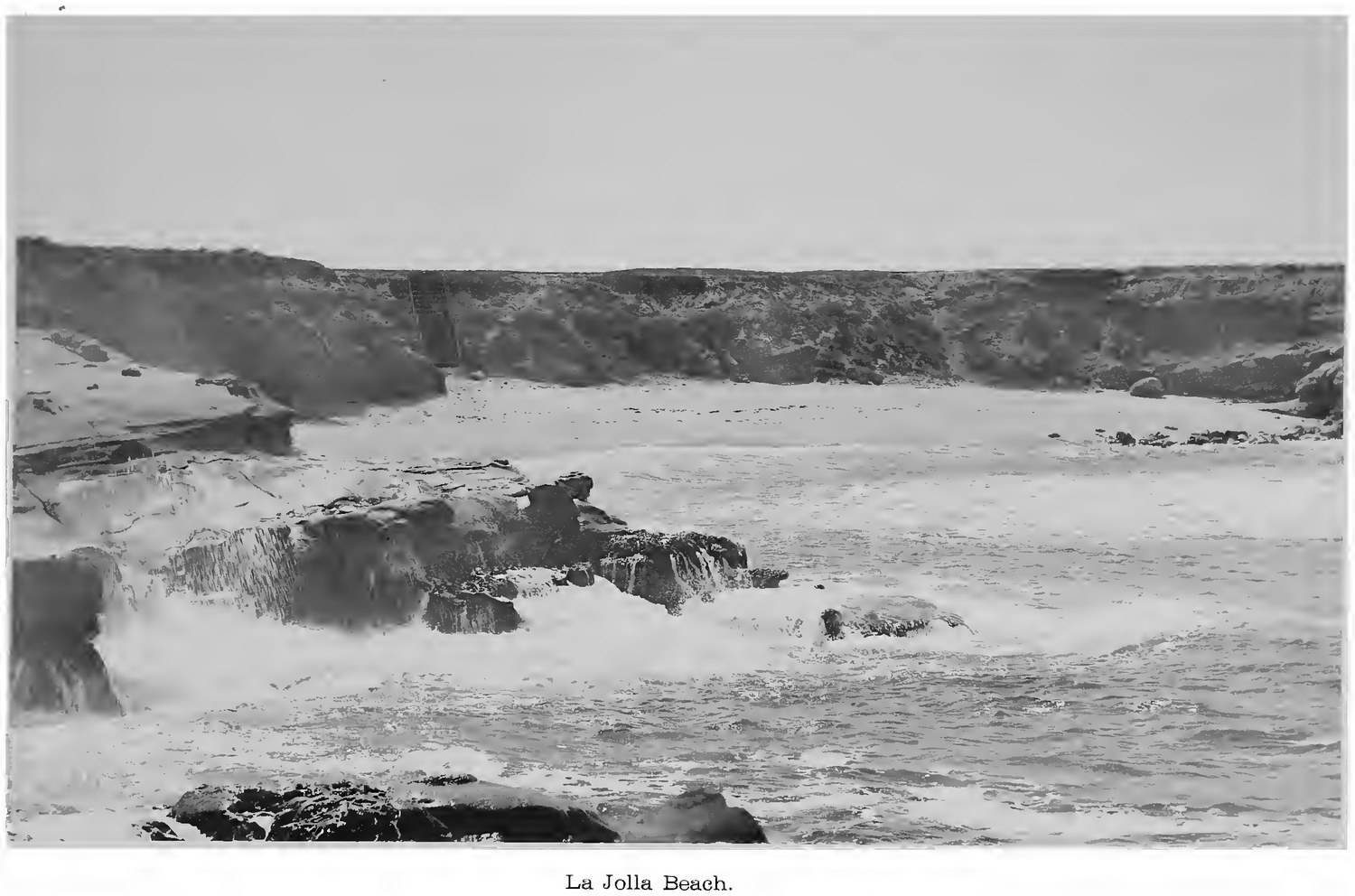 The rocky shoreline and surf at La Jolla, California, photographed in 1887, forty four years before the Children's Pool breakwater was built