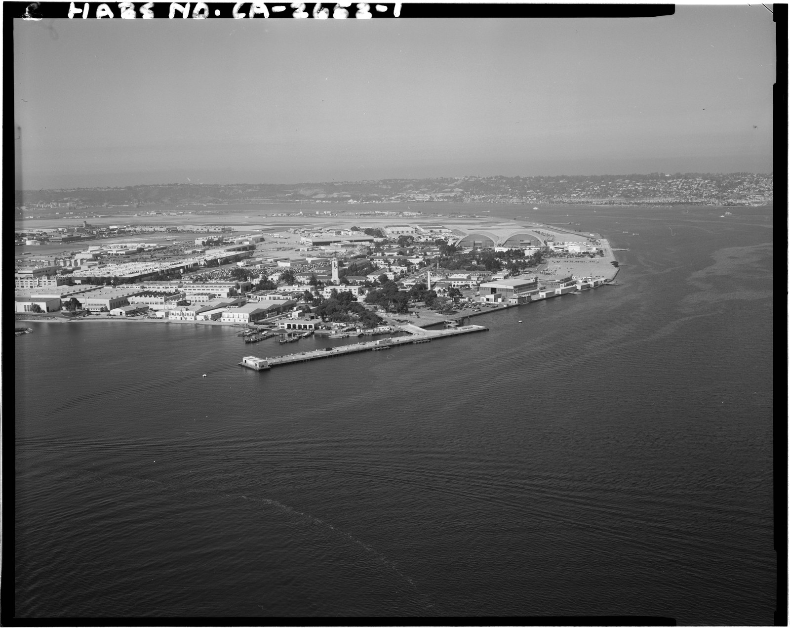 An aerial photograph taken in 1995 looking west across North Island, showing continuous built ground where the Spanish Bight channel used to be