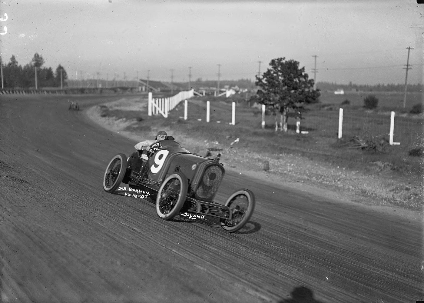 Bob Burman in a Peugeot number 9 on a dirt road course. Photographed at Tacoma