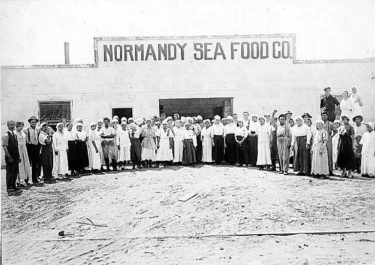 Workers standing outside the Normandy Sea Food Company processing building in San Diego, California, around 1918