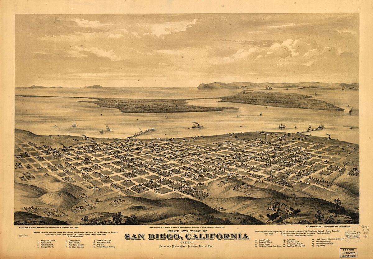 A sepia lithograph of a small grid town on bare hills above a wide bay, ships at anchor, a peninsula and the open ocean in the distance
